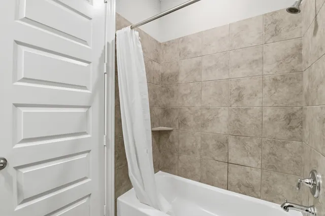 a bathroom with a tub and vanity