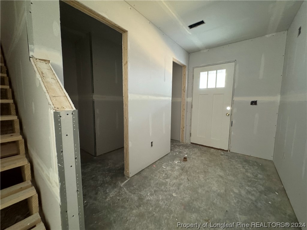828 Poole Road Raeford, NC 28376 - Photo 6 of 20 an empty room with windows