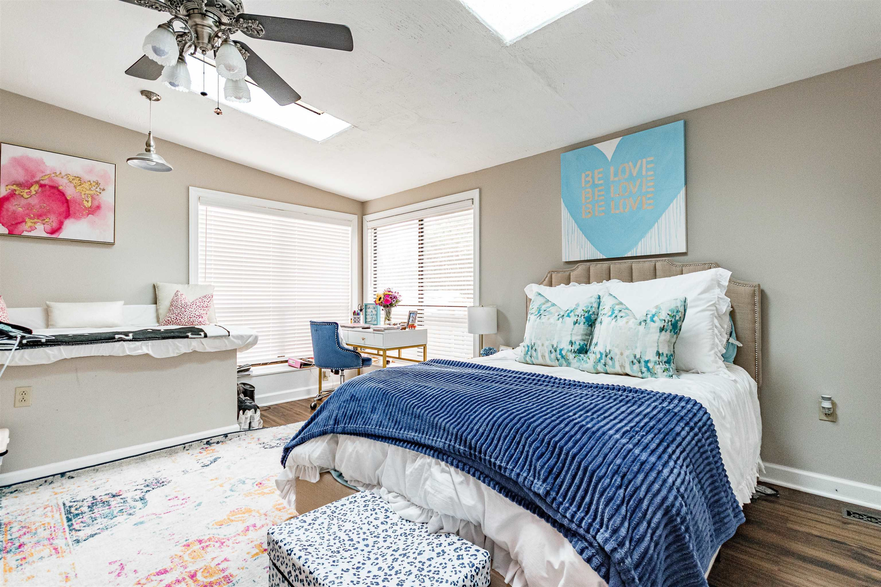 618 Brooks Avenue Raleigh, NC 27607 - Photo 11 of 27 a bedroom with a bed and a chandelier