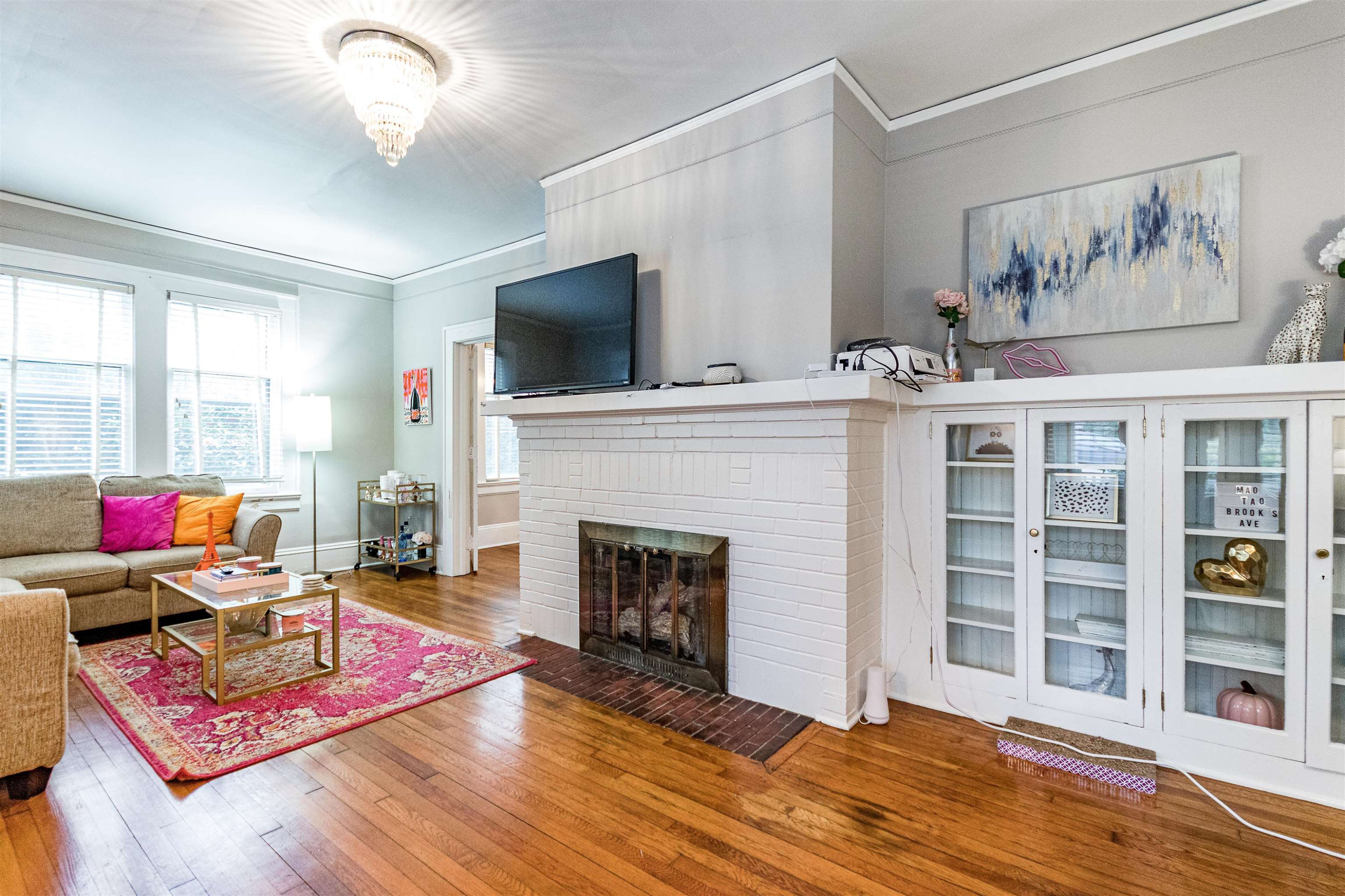 618 Brooks Avenue Raleigh, NC 27607 - Photo 3 of 27 a living room with furniture and a fireplace