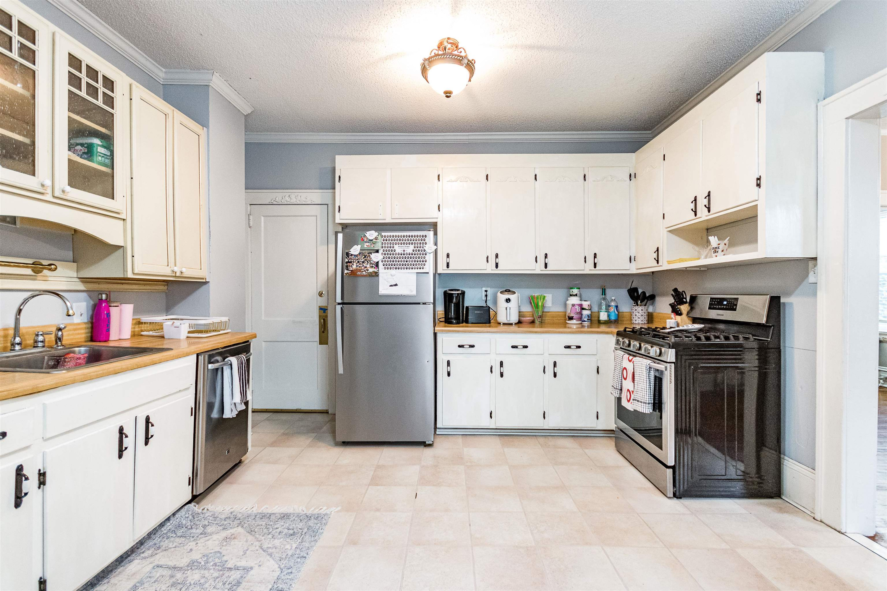 618 Brooks Avenue Raleigh, NC 27607 - Photo 7 of 27 a kitchen with cabinets and steel stainless steel appliances