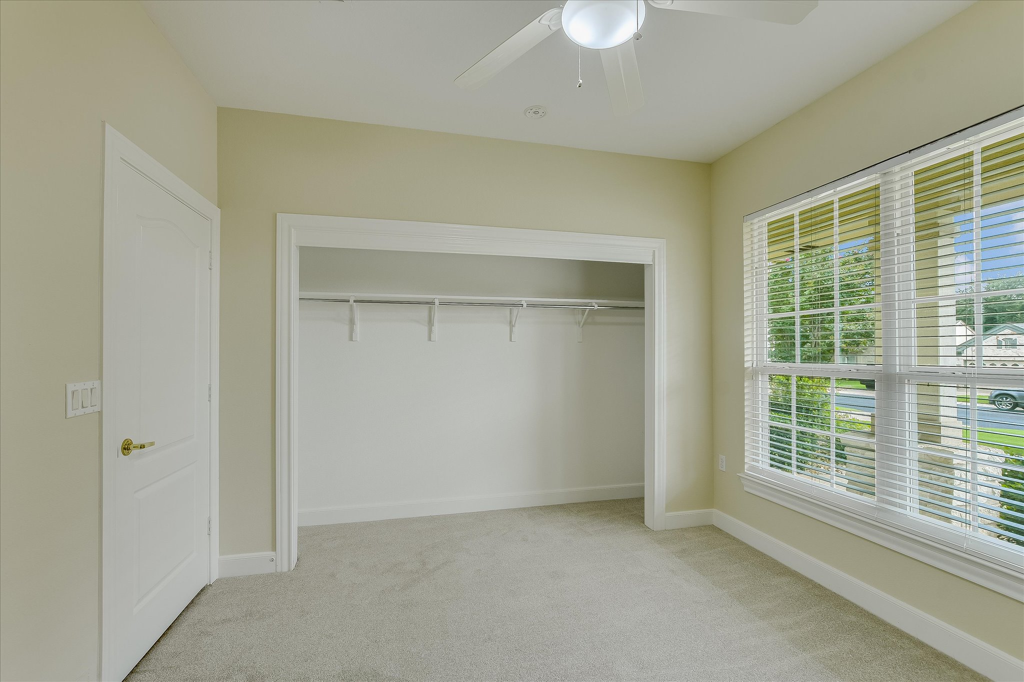 603 Rio Grande Loop Georgetown, TX 78633 - Photo 23 of 27 Unfurnished bedroom with light carpet, a ceiling fan, and a closet