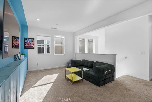 a bedroom with a bed and chair