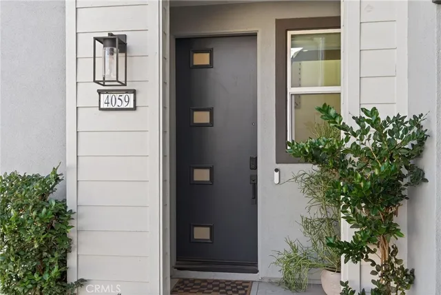 view of front door and potted plants
