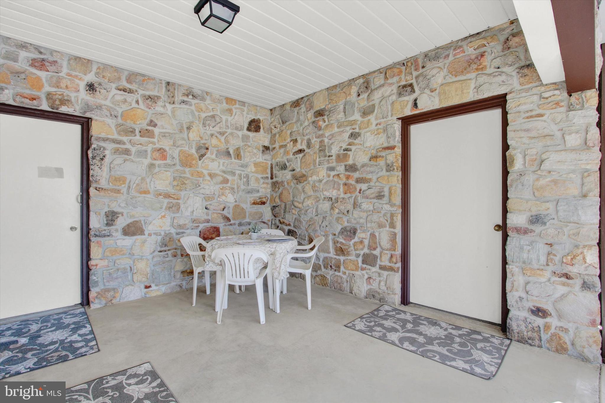 5563 Sheller Road Chambersburg, PA 17202 - Photo 19 of 29 Breezeway leading to garage and storage room