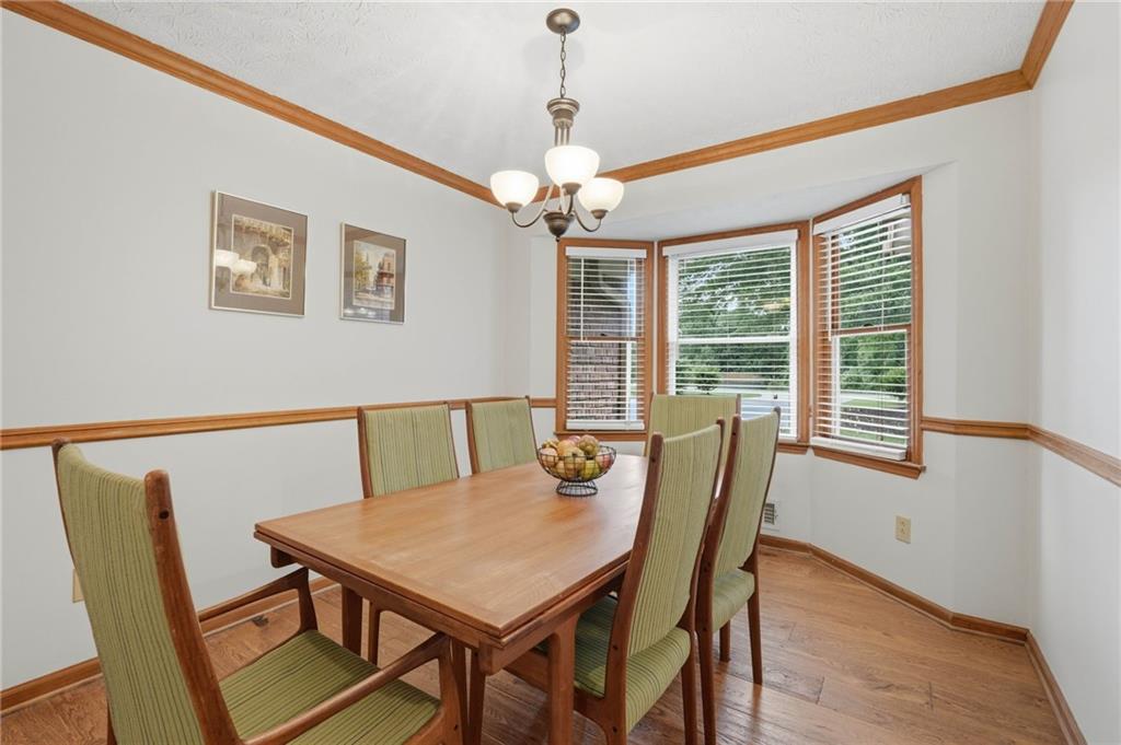 4891 Bill Cheek Road Auburn, GA 30011 - Photo 14 of 99 a view of a dining room with furniture window and outside view