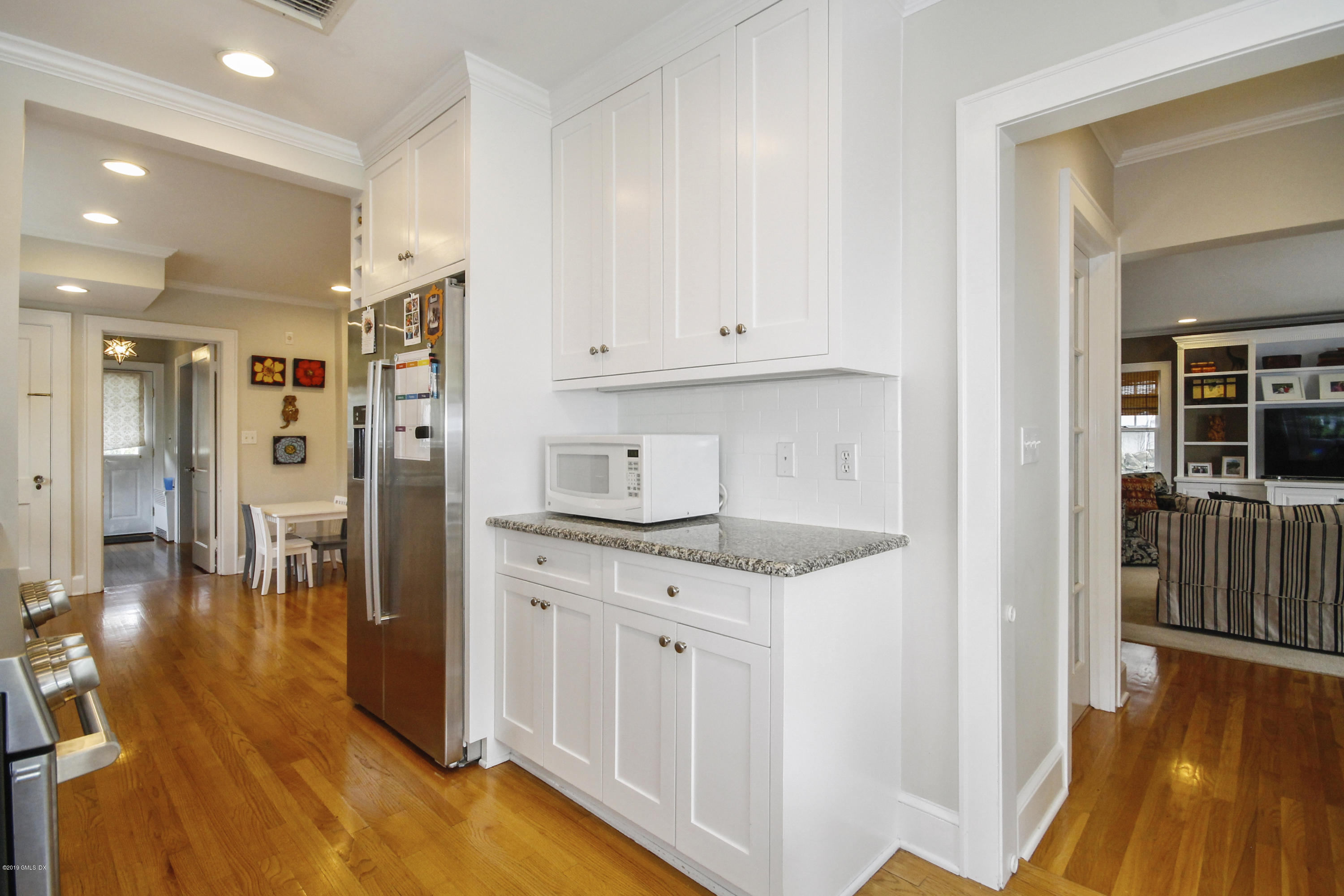 46 Orchard Place Greenwich, CT 06830 - Photo 11 of 34 a kitchen with granite countertop a refrigerator and a stove top oven