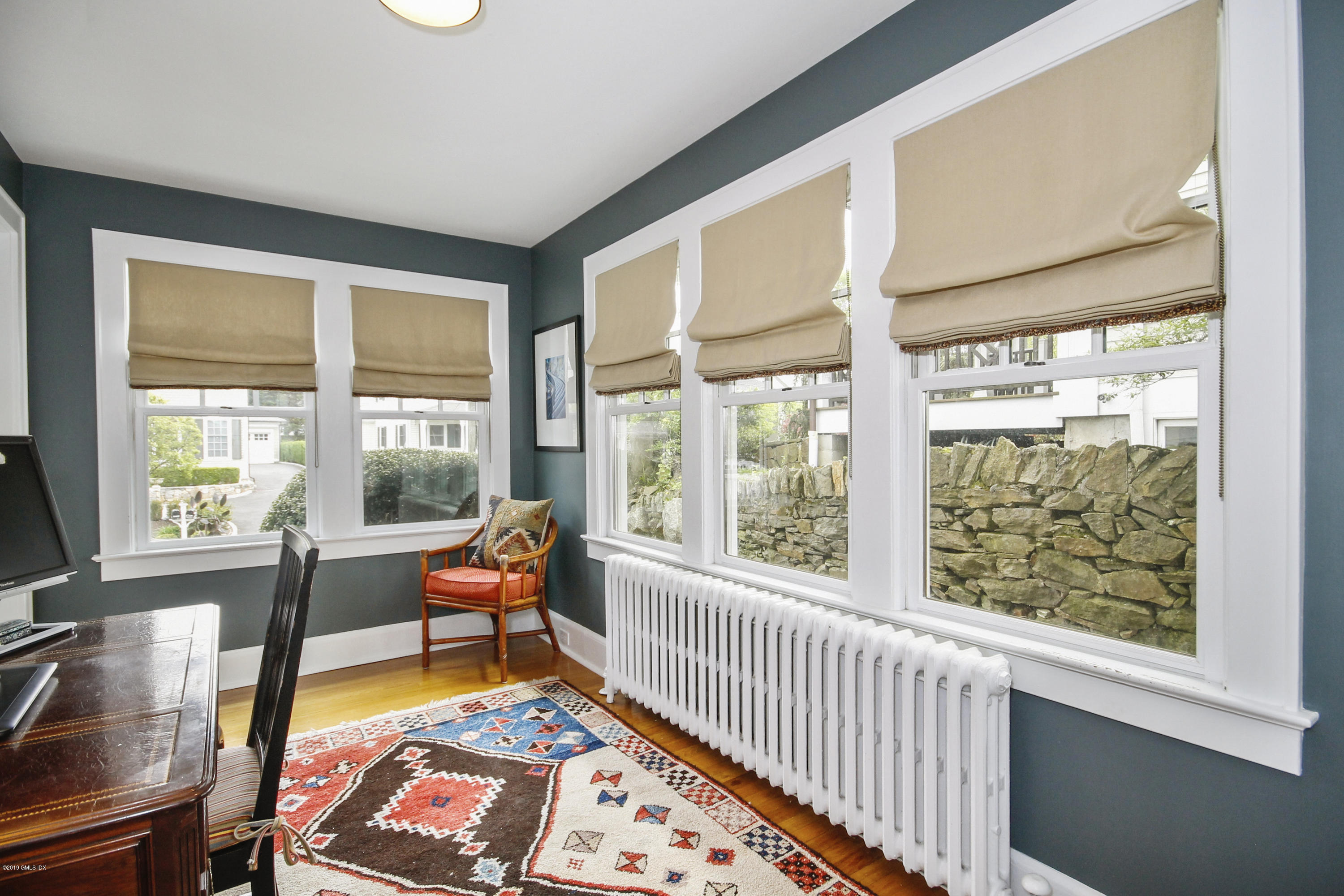 46 Orchard Place Greenwich, CT 06830 - Photo 16 of 34 a living room with furniture and a large window