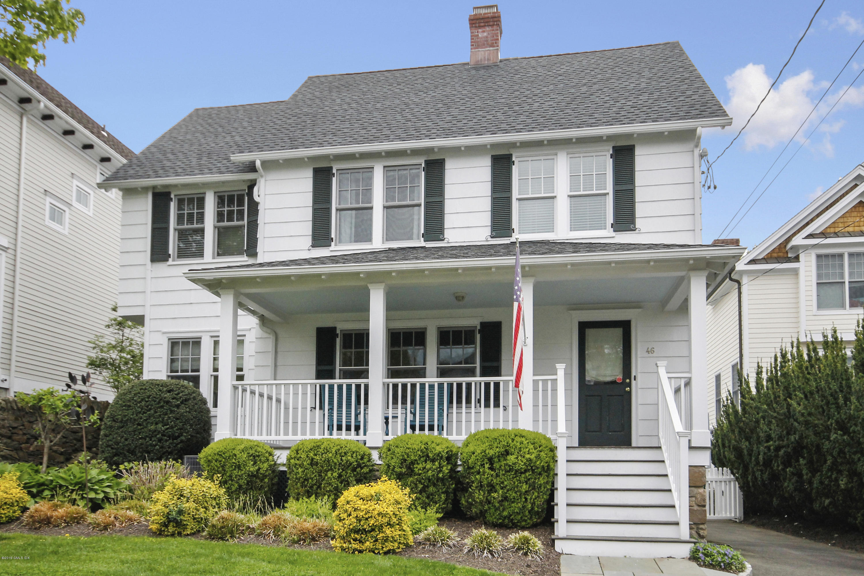 46 Orchard Place Greenwich, CT 06830 - Photo 2 of 34 a front view of a house with garden