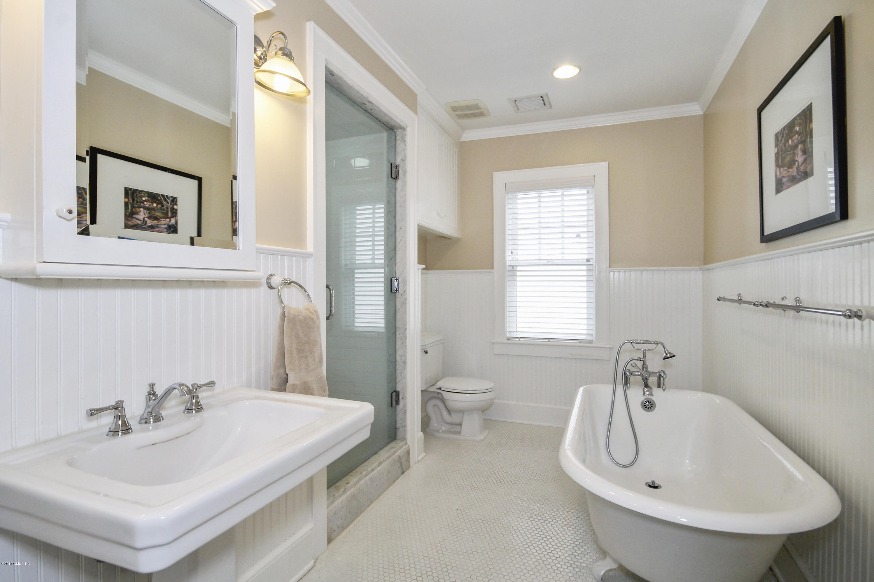 46 Orchard Place Greenwich, CT 06830 - Photo 22 of 34 a bathroom with a sink and a mirror