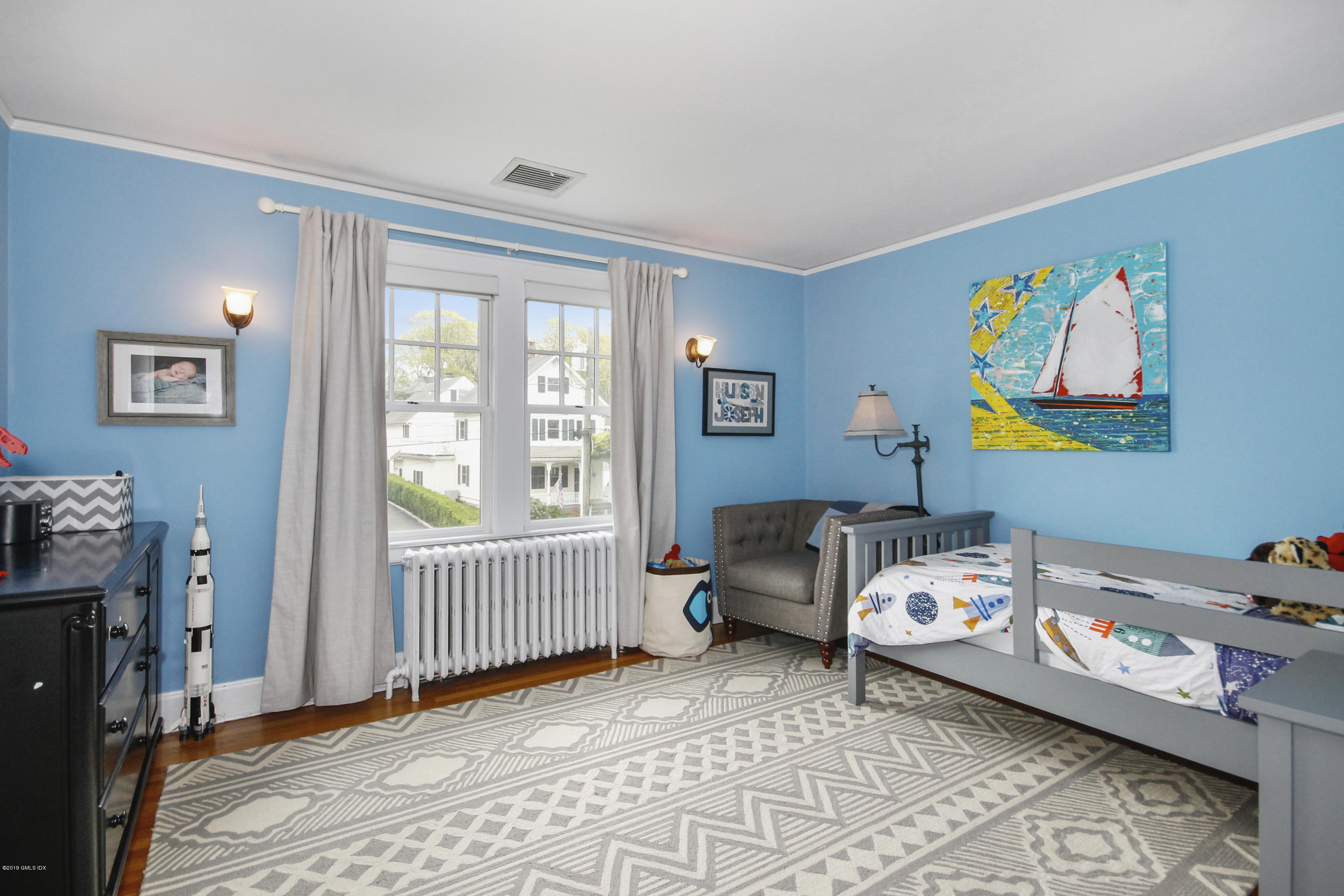 46 Orchard Place Greenwich, CT 06830 - Photo 24 of 34 a bedroom with furniture and a window