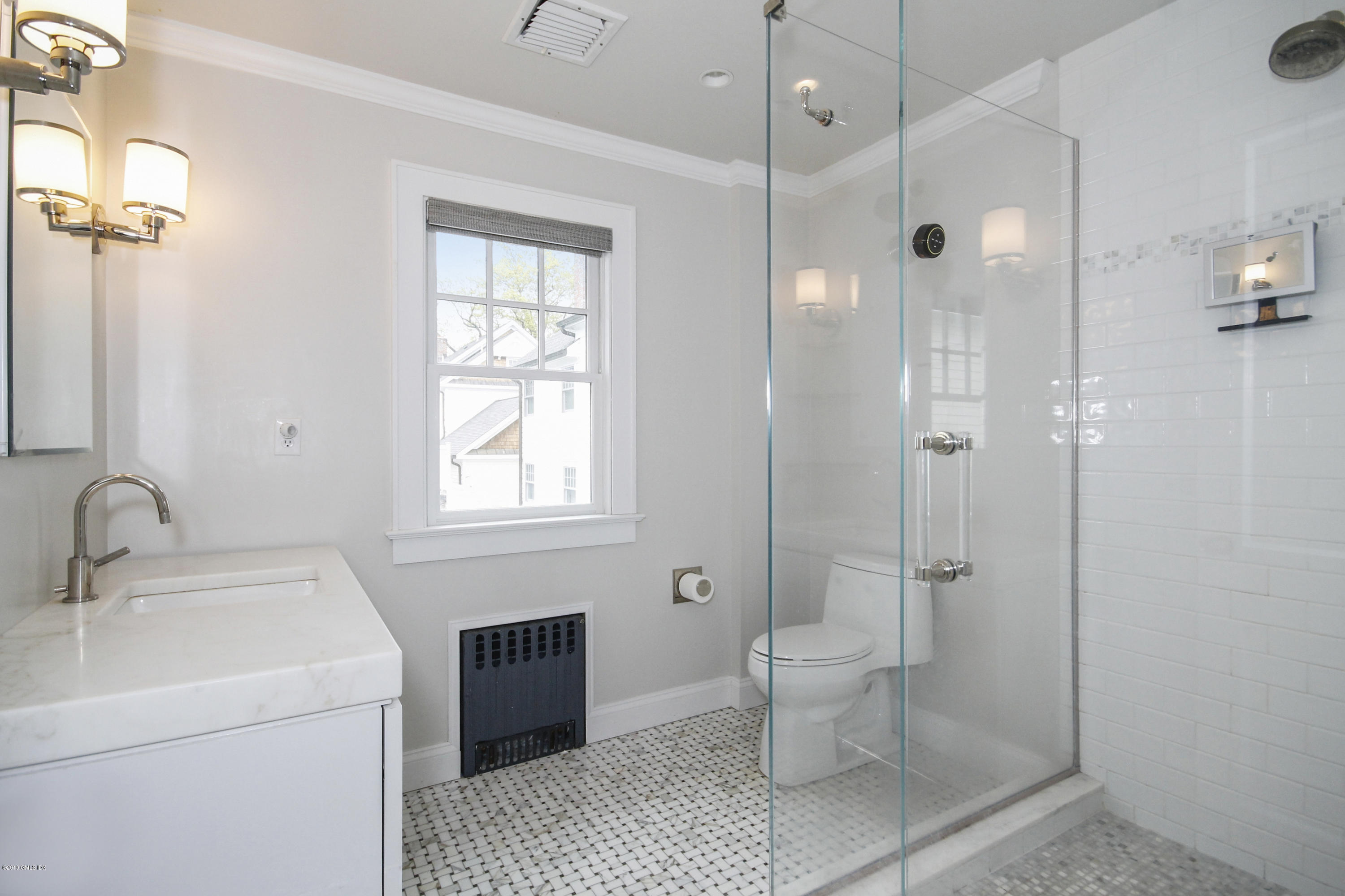 46 Orchard Place Greenwich, CT 06830 - Photo 26 of 34 a bathroom with a toilet sink and shower