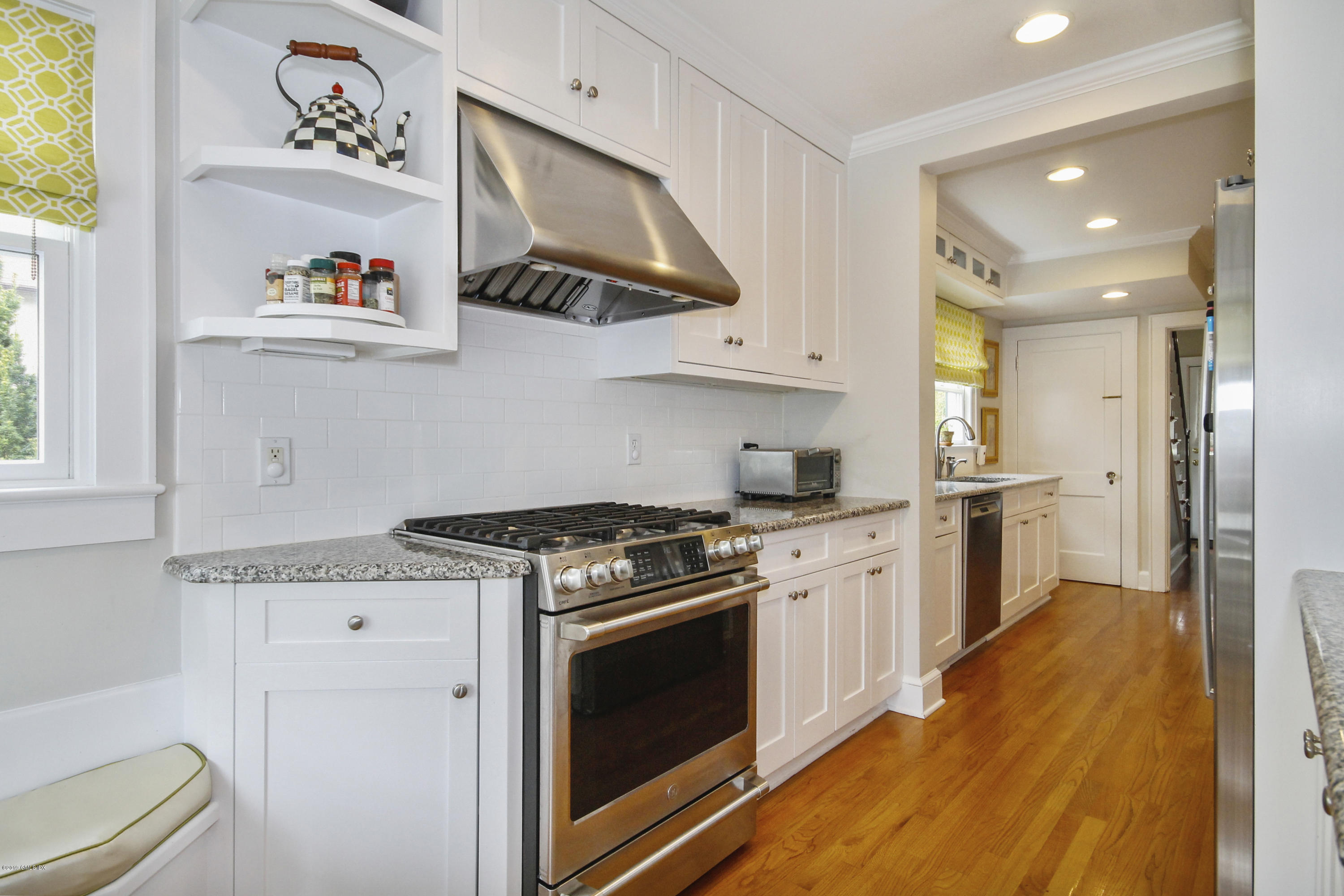 46 Orchard Place Greenwich, CT 06830 - Photo 10 of 34 a kitchen with a stove a sink and a refrigerator