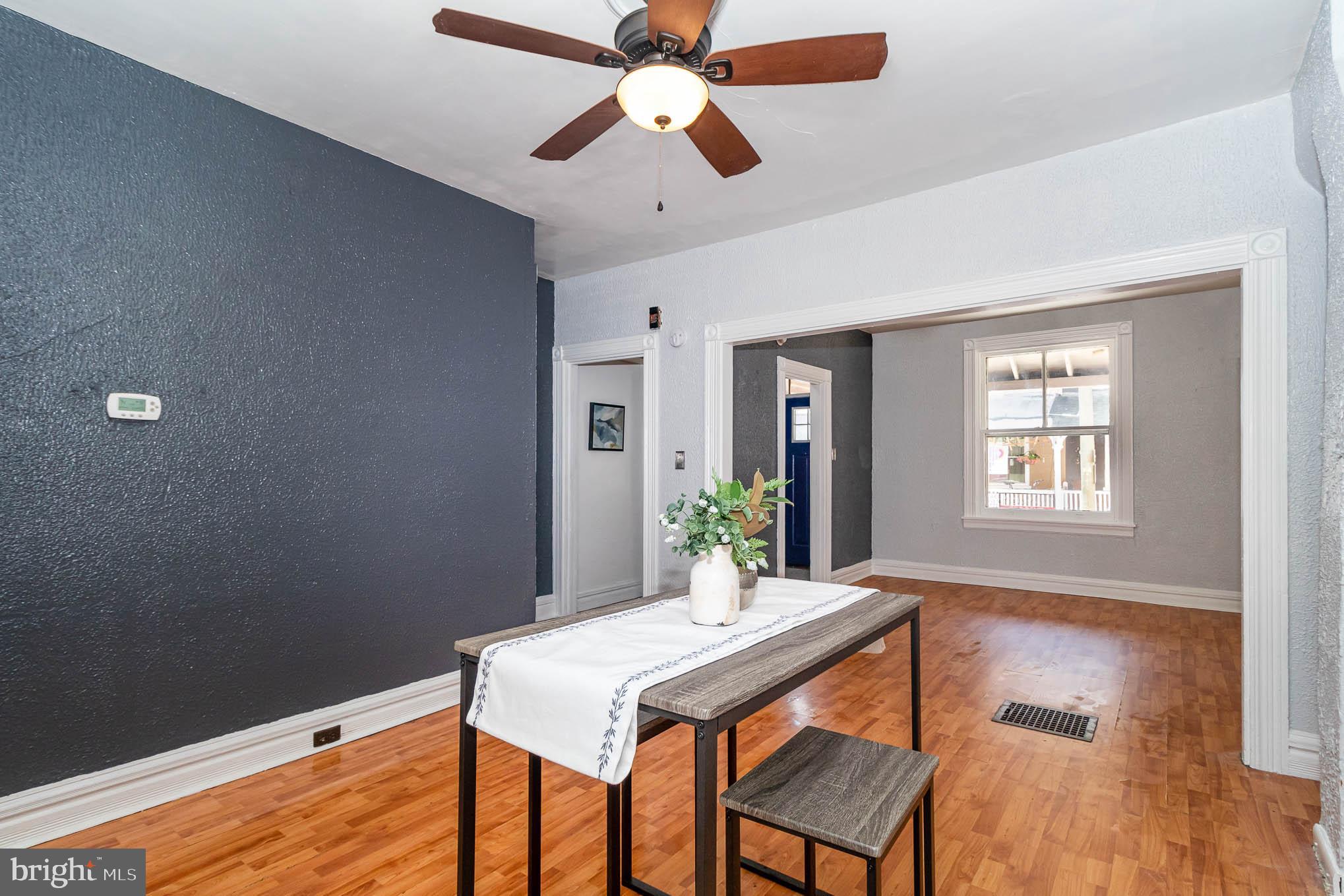 549 Spruce Street Lancaster, PA 17603 - Photo 13 of 29 a room with chandelier fan and wooden floor