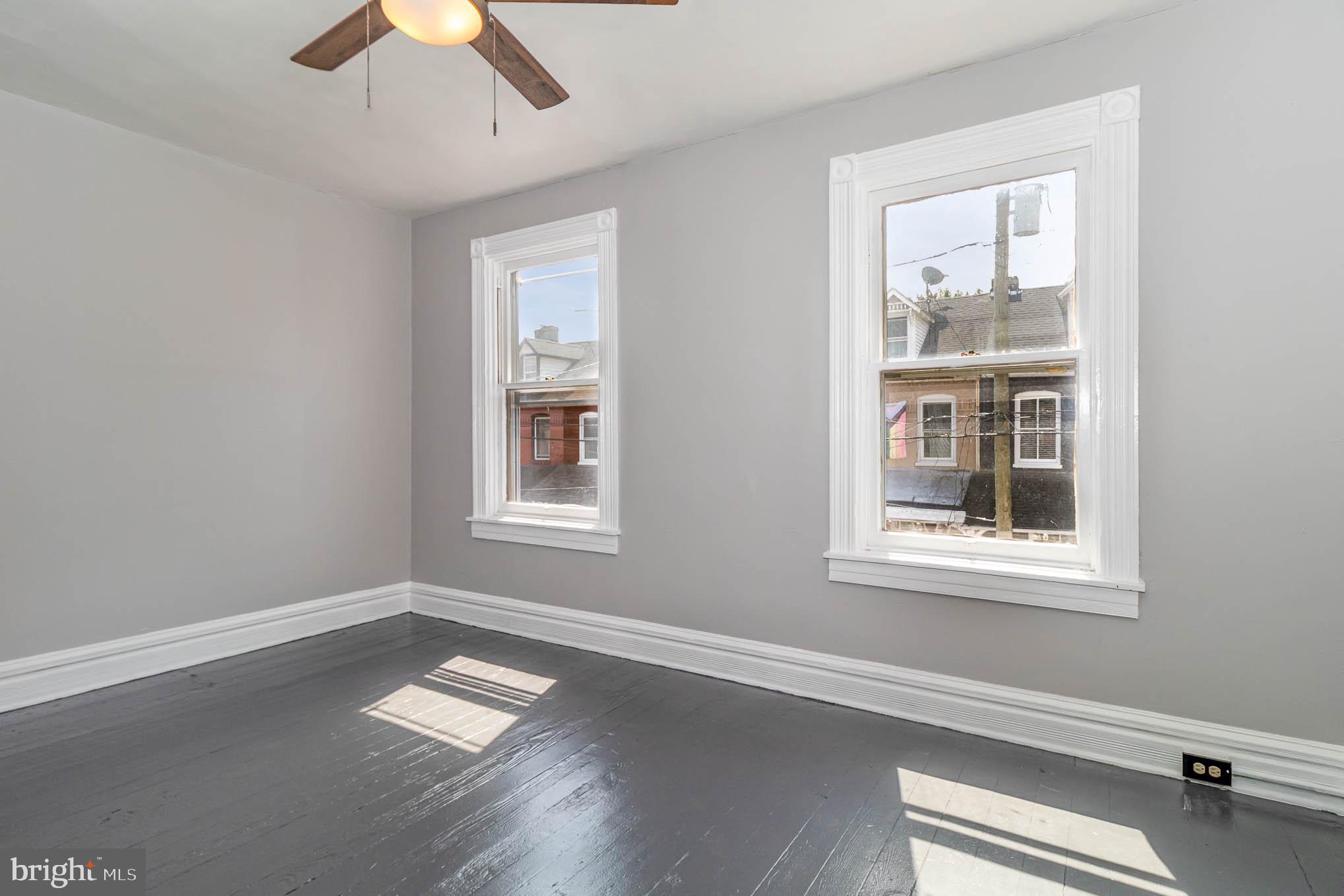 549 Spruce Street Lancaster, PA 17603 - Photo 18 of 29 an empty room with wooden floor and windows