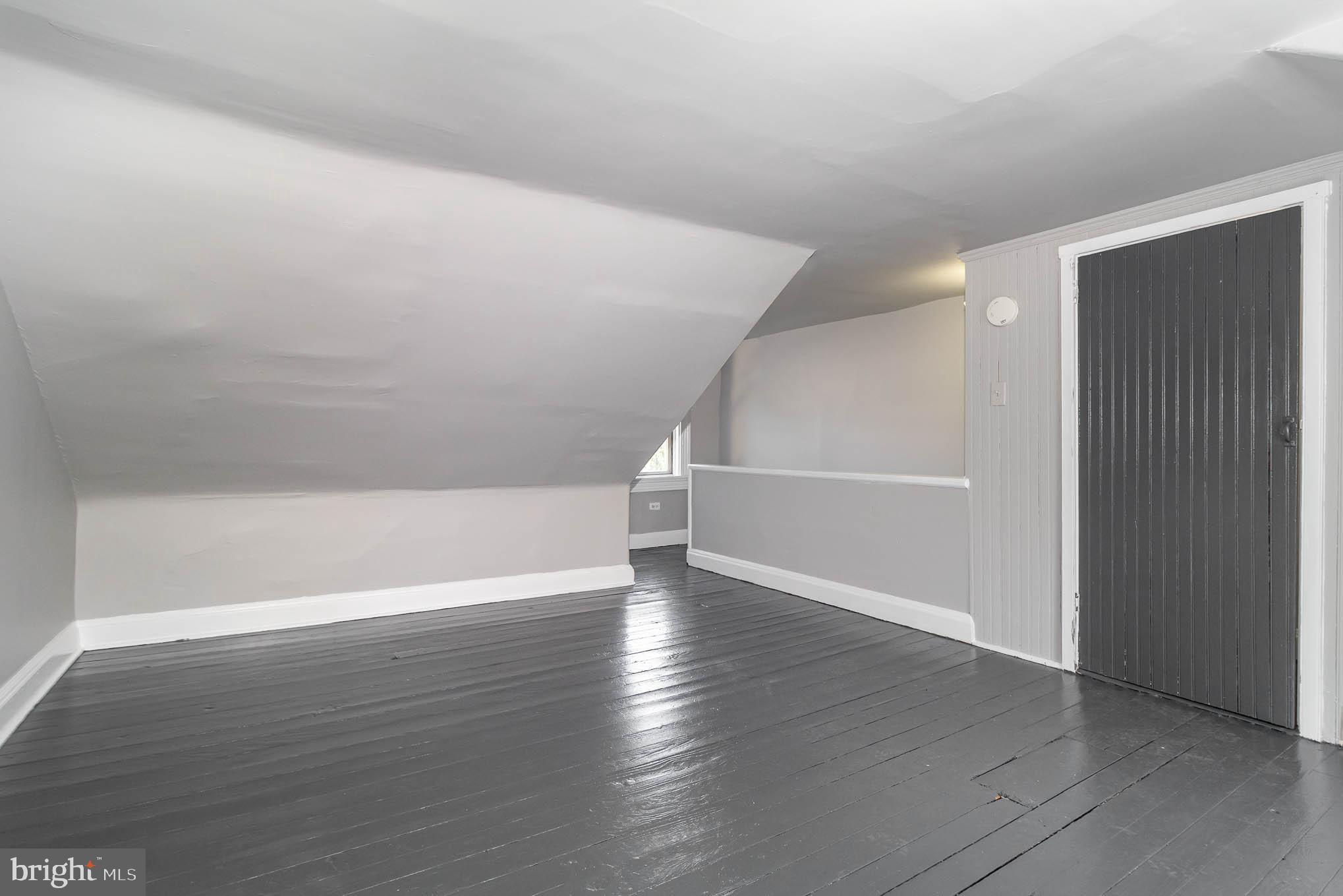 549 Spruce Street Lancaster, PA 17603 - Photo 22 of 29 a view of an empty room with wooden floor