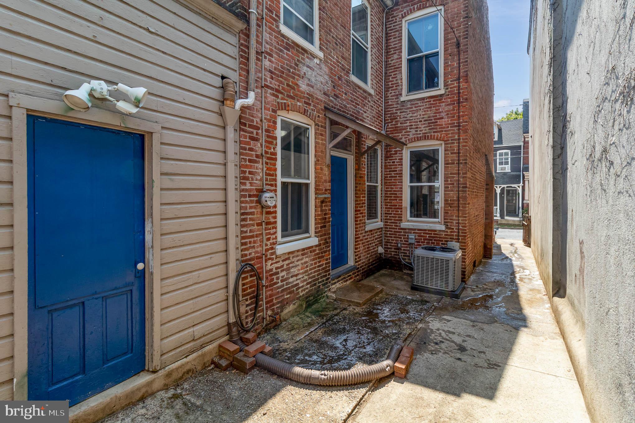 549 Spruce Street Lancaster, PA 17603 - Photo 24 of 29 a view of a patio with table and chairs and wooden fence