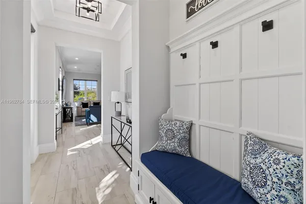 a kitchen with cabinets stainless steel appliances and wooden floor