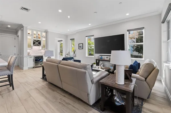 a view of staircase with wooden floor and white walls