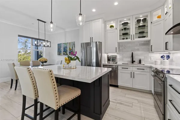 a living room with furniture and a lamp