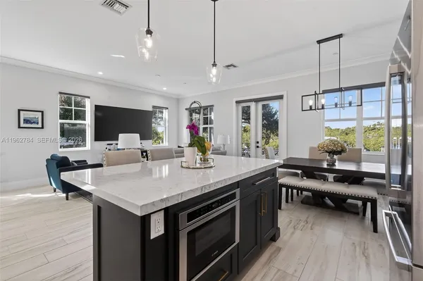 a bedroom with a bed potted plant and a window