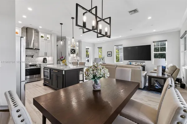a view of living room with furniture and a potted plant