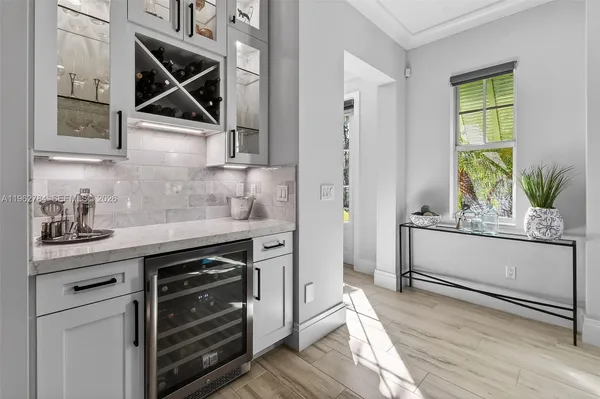 a view of a chairs and table in the balcony