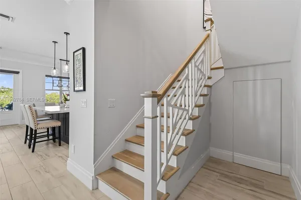 a bedroom with a large bed and a tv on table
