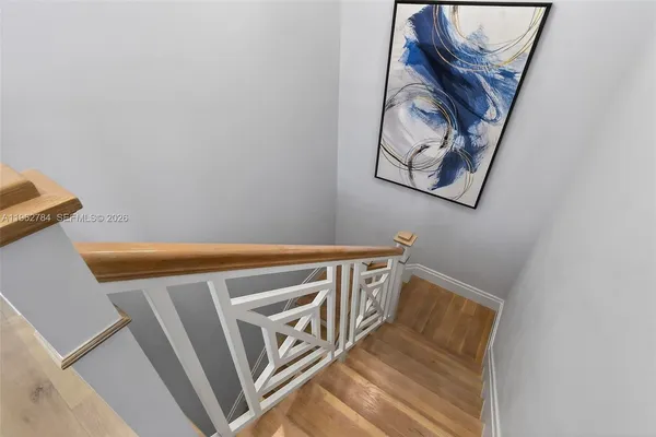 a bedroom with a large bed and a flat screen tv