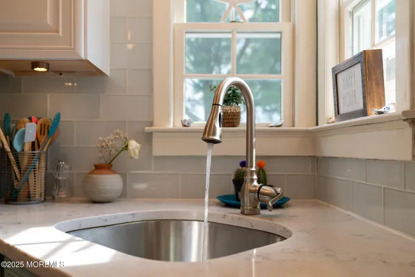 a bathroom with a toilet a sink and a mirror