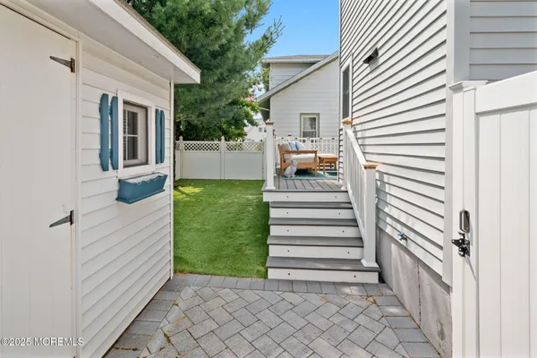 an aerial view of a house with a yard and a fountain