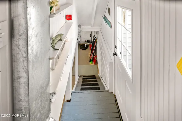 a view of a livingroom with furniture and a kitchen