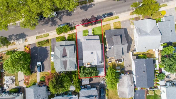 a view of a house with a yard and a deck
