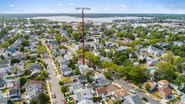 an aerial view of residential building and ocean