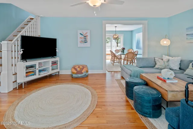 a bedroom with furniture and wooden floor