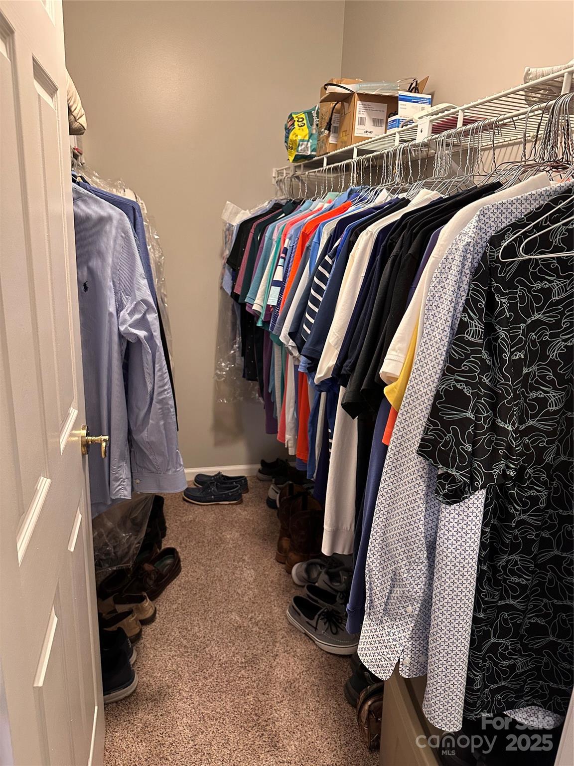 450 Case Cove Road, Unit 85 Candler, NC 28715 - Photo 4 of 14 a view of walk in closet with clothes and shoes