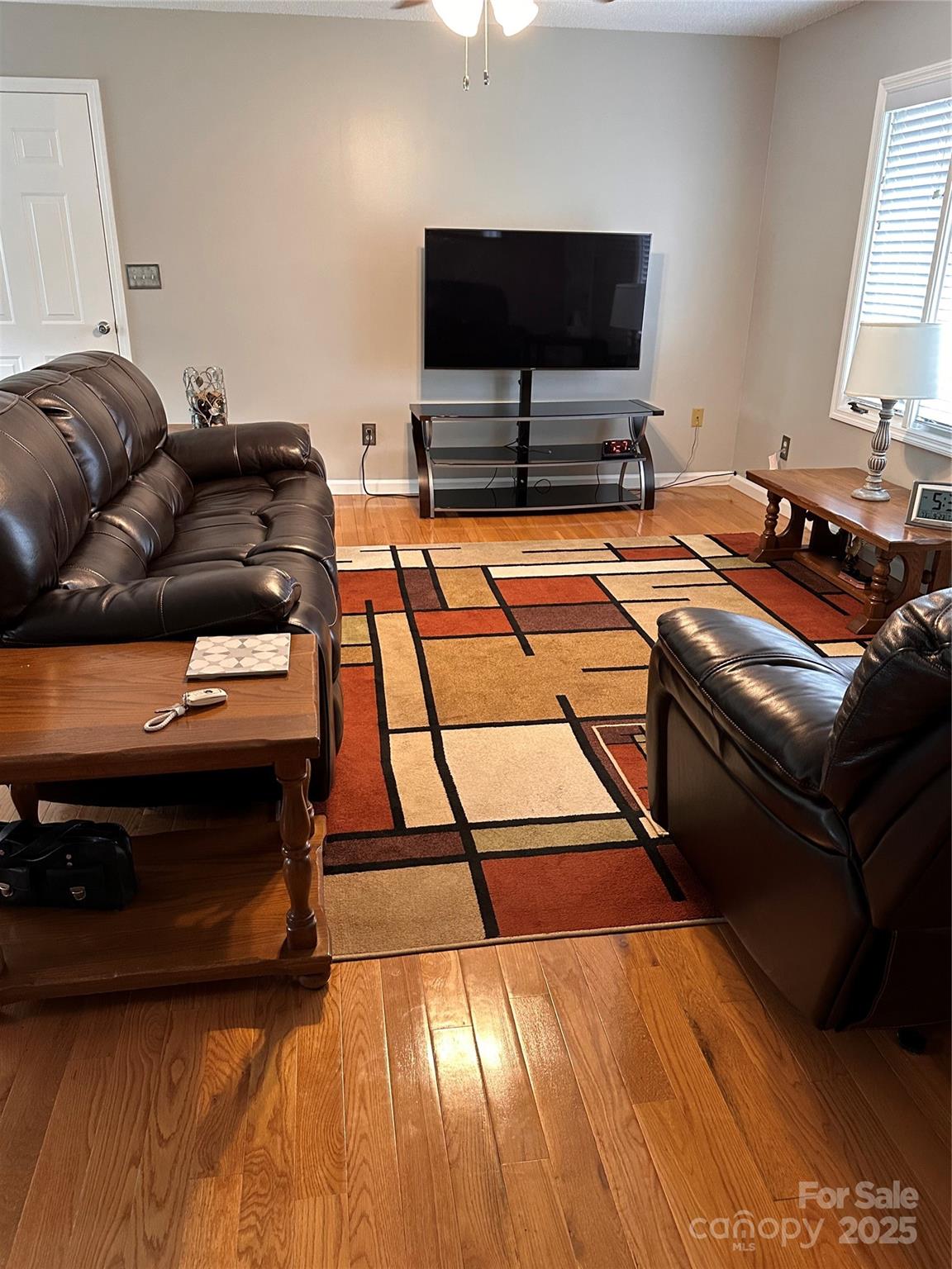 450 Case Cove Road, Unit 85 Candler, NC 28715 - Photo 6 of 14 a living room with furniture and a flat screen tv