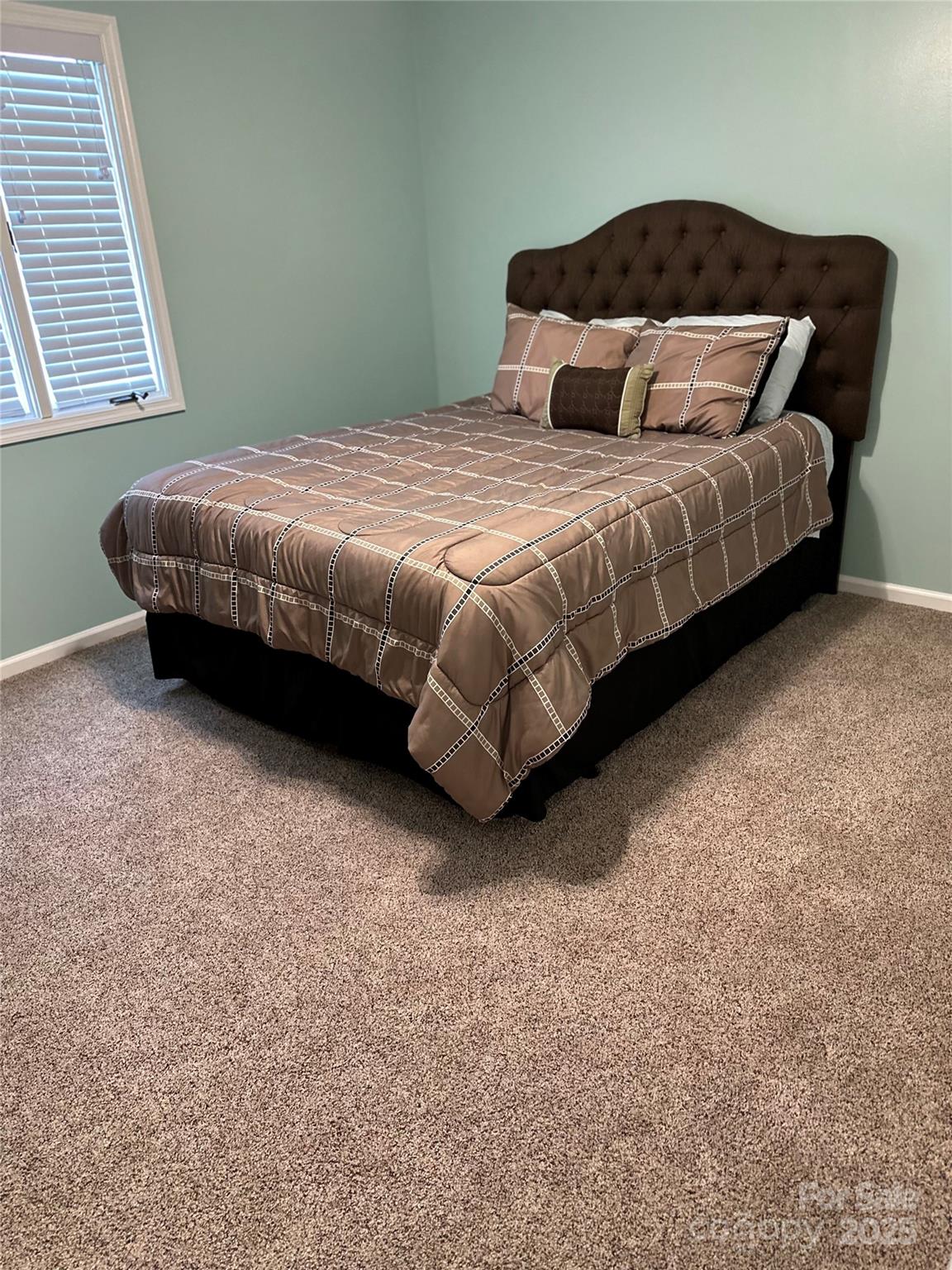 450 Case Cove Road, Unit 85 Candler, NC 28715 - Photo 9 of 14 a bedroom with a bed and a window