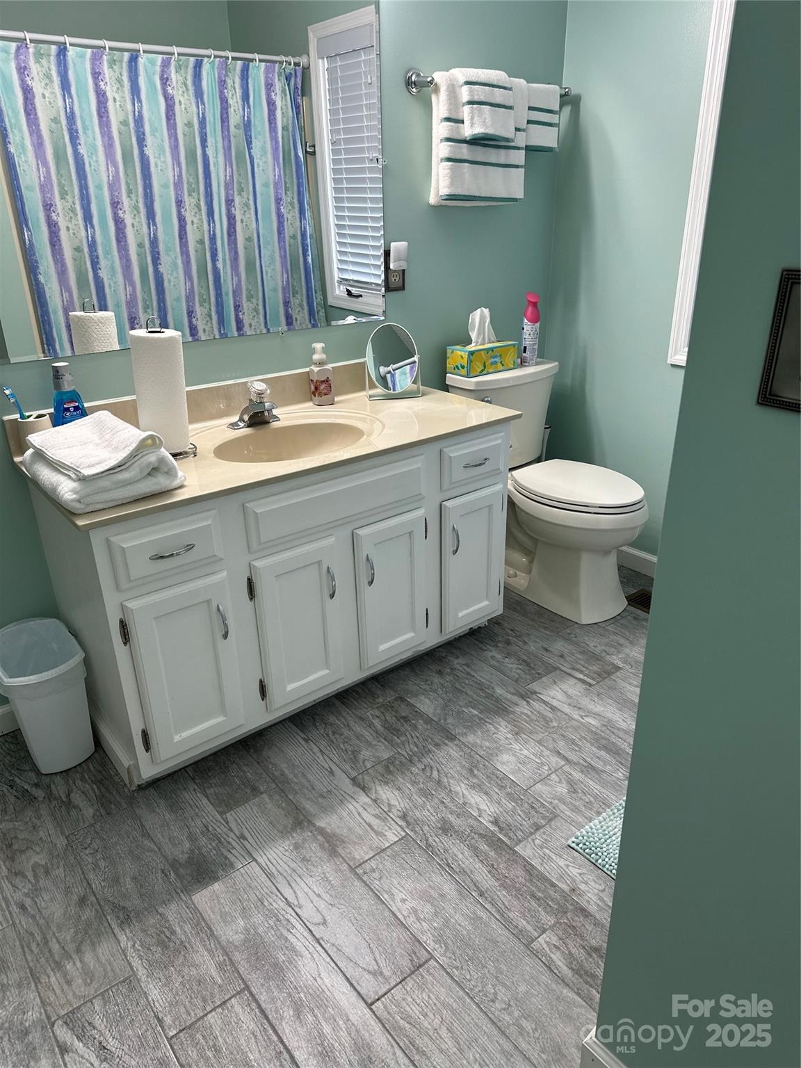 450 Case Cove Road, Unit 85 Candler, NC 28715 - Photo 10 of 14 a bathroom with a granite countertop toilet and a sink