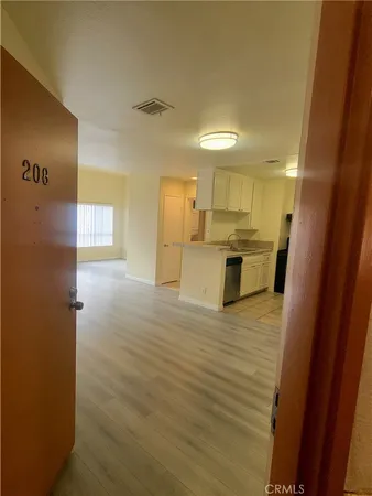 a view of a kitchen from the hallway