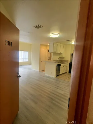 a view of a kitchen from the hallway