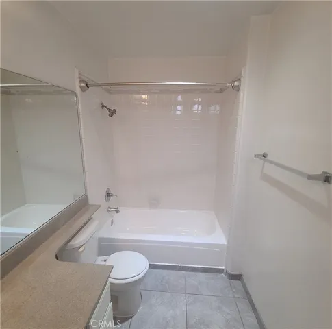 a bathroom with a bathtub and a toilet
