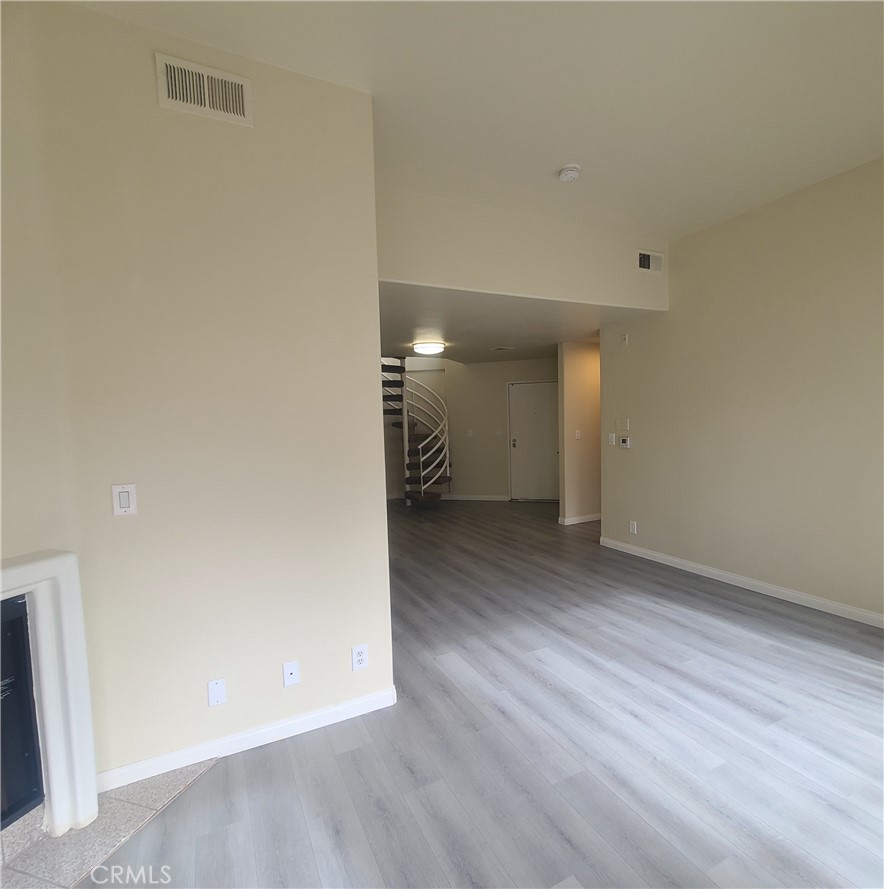 5060 Kester Avenue, Unit 208 Sherman Oaks, CA 91403 - Photo 15 of 31 a view of a hallway with wooden floor