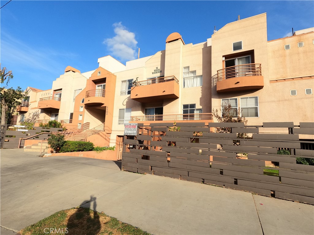 5060 Kester Avenue, Unit 208 Sherman Oaks, CA 91403 - Photo 24 of 31 a front view of a building with outdoor space