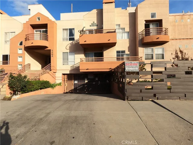 an outdoor space with patio furniture and potted plants