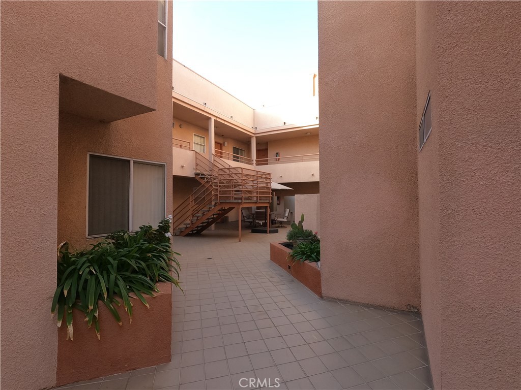 5060 Kester Avenue, Unit 208 Sherman Oaks, CA 91403 - Photo 27 of 31 a house that has a potted plant and a window
