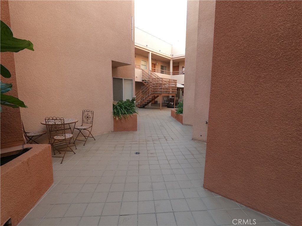 5060 Kester Avenue, Unit 208 Sherman Oaks, CA 91403 - Photo 28 of 31 an outdoor space with patio furniture and potted plants