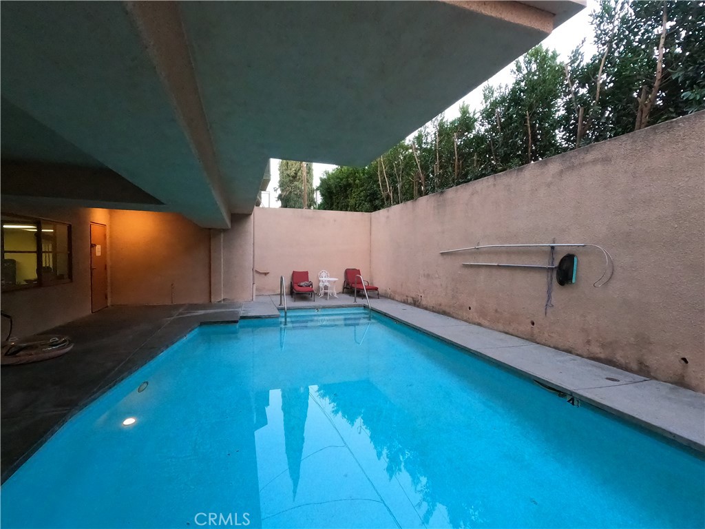 5060 Kester Avenue, Unit 208 Sherman Oaks, CA 91403 - Photo 31 of 31 a backyard with hardwood and a lake view