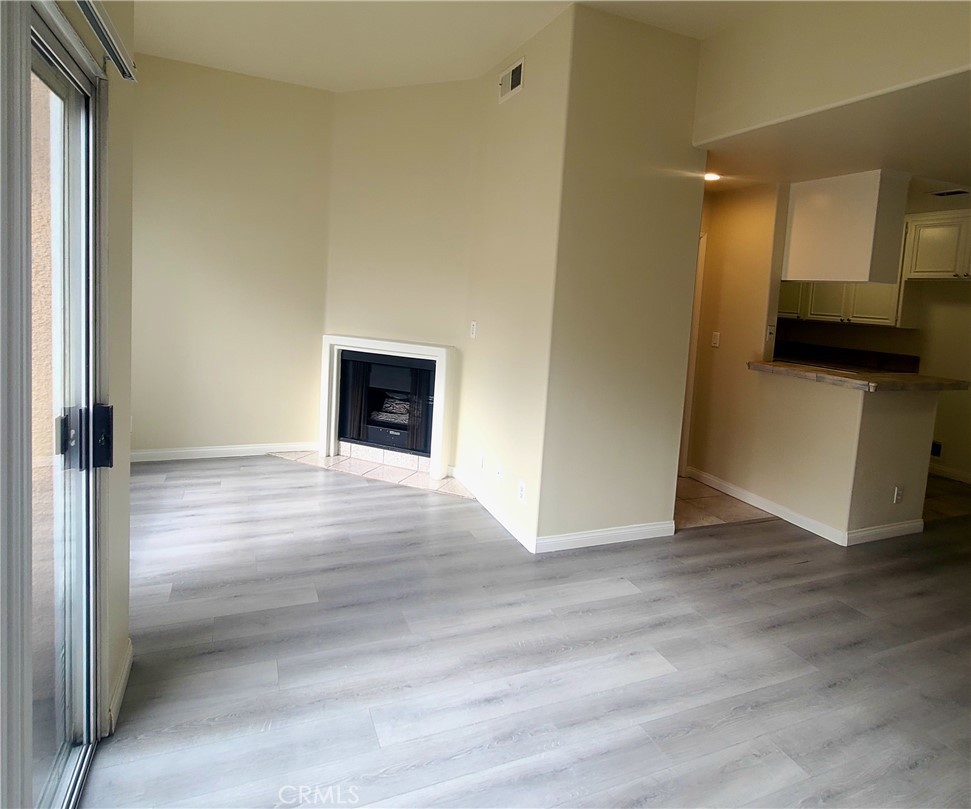 5060 Kester Avenue, Unit 208 Sherman Oaks, CA 91403 - Photo 9 of 31 a view of a kitchen from the hallway