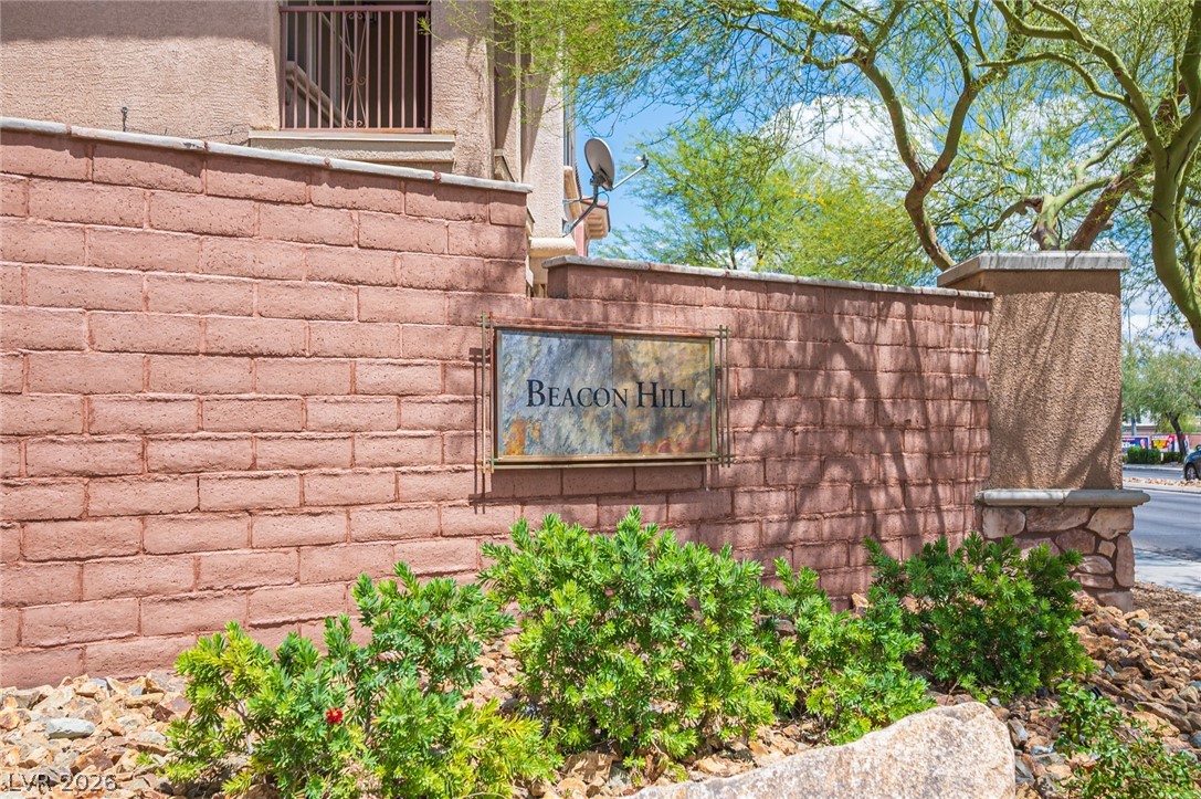 9916 Sable Point Street Las Vegas, NV 89178 - Photo 57 of 73 A welcoming brick wall entrance sign defines the Beacon Hill community against a bright, sunny backdrop.